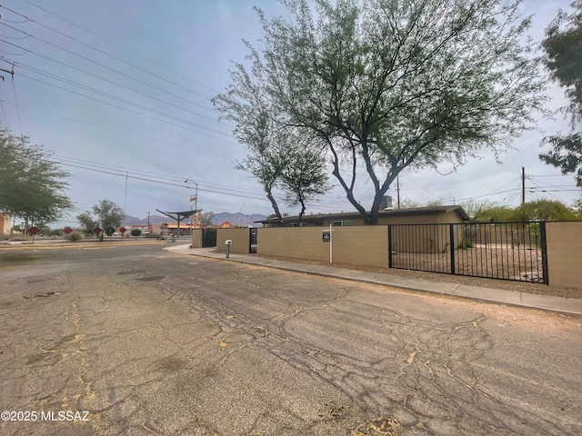 2330 N Los Altos Ave, Tucson, AZ 85705 - view of asphalt road with sidewalks, curbs, and street lighting