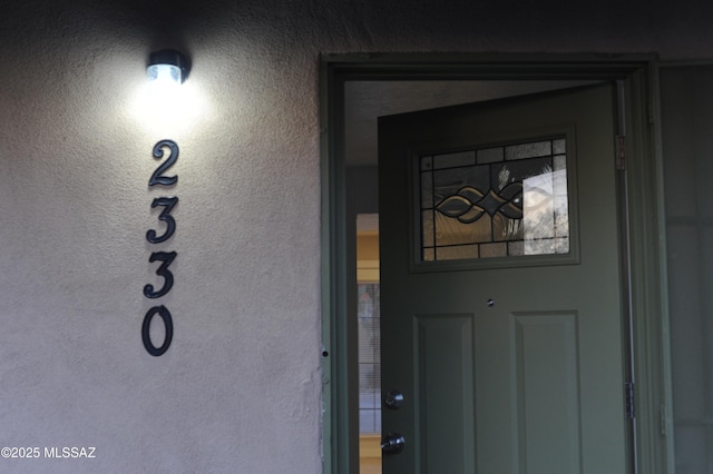 2330 N Los Altos Ave, Tucson, AZ 85705 - doorway to property featuring stucco siding