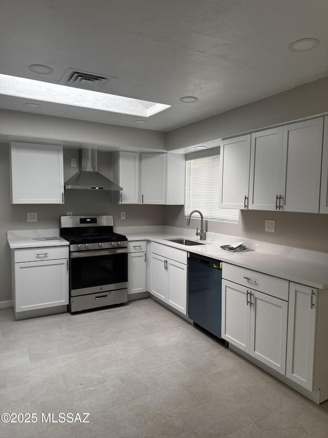 2330 N Los Altos Ave, Tucson, AZ 85705 - kitchen featuring wall chimney range hood, stainless steel gas range oven, dishwasher, and light countertops