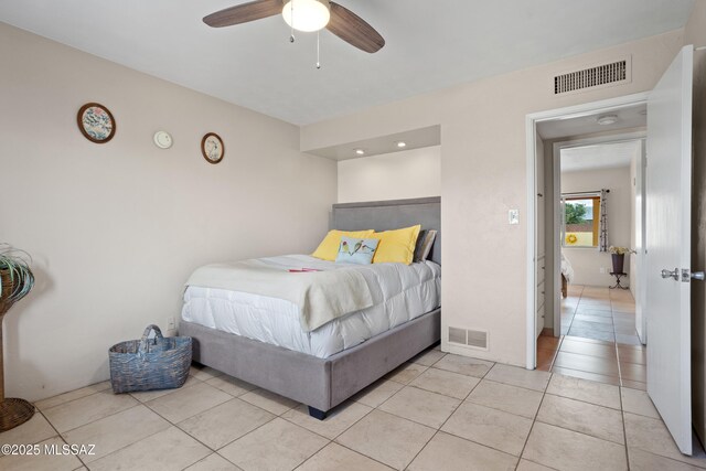 4302 E 6th St, Tucson, AZ 85711 - bedroom with light tile patterned floors and ceiling fan