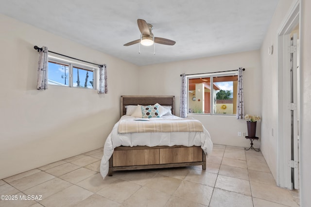 4302 E 6th St, Tucson, AZ 85711 - bedroom featuring light tile patterned flooring and a ceiling fan