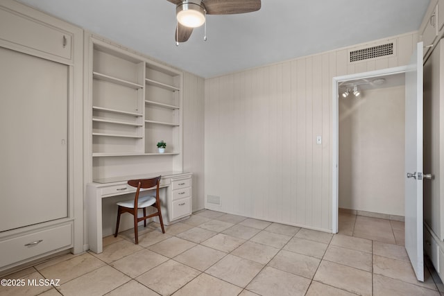 4302 E 6th St, Tucson, AZ 85711 - office with ceiling fan, baseboards, light tile patterned floors, and built in desk