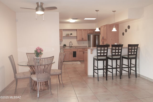 4302 E 6th St, Tucson, AZ 85711 - dining area with light tile patterned floors, a ceiling fan, and baseboards