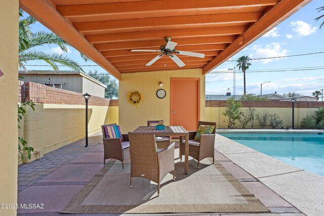 4302 E 6th St, Tucson, AZ 85711 - fenced backyard with a patio, outdoor dining area, and a ceiling fan