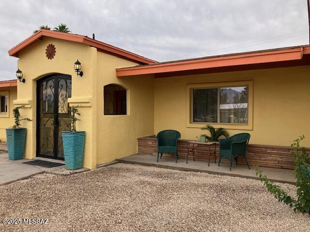 4302 E 6th St, Tucson, AZ 85711 - view of front of house with stucco siding and a patio
