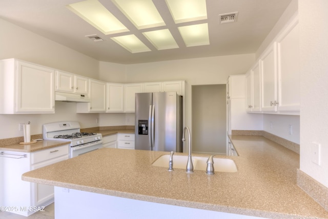 2312 E Coreopsis Way, Oro Valley, AZ 85755 - kitchen featuring stainless steel refrigerator with ice dispenser, white range with gas stovetop, under cabinet range hood, a peninsula, and a sink