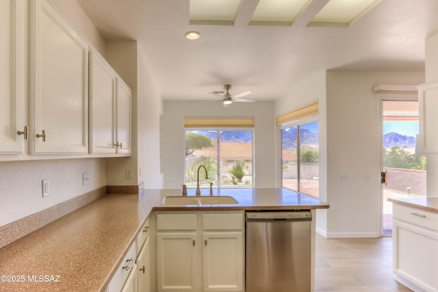 2312 E Coreopsis Way, Oro Valley, AZ 85755 - kitchen featuring stainless steel dishwasher, a sink, a peninsula, a ceiling fan, and white cabinets