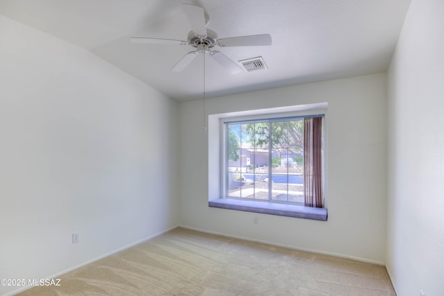 2312 E Coreopsis Way, Oro Valley, AZ 85755 - spare room with light carpet, a ceiling fan, baseboards, and vaulted ceiling