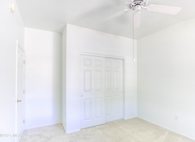 2312 E Coreopsis Way, Oro Valley, AZ 85755 - unfurnished bedroom with light colored carpet, a closet, a ceiling fan, and baseboards