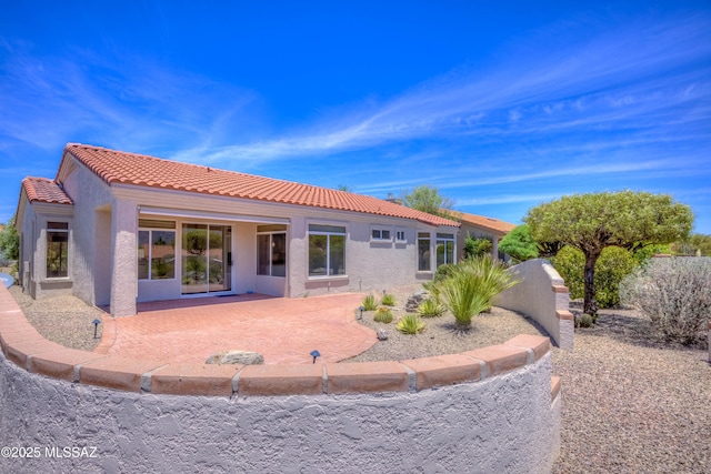 2312 E Coreopsis Way, Oro Valley, AZ 85755 - rear view of property featuring stucco siding, a tiled roof, and a patio area