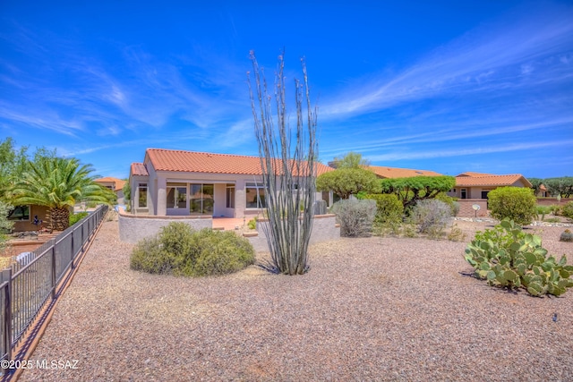 2312 E Coreopsis Way, Oro Valley, AZ 85755 - rear view of house featuring a tile roof and stucco siding