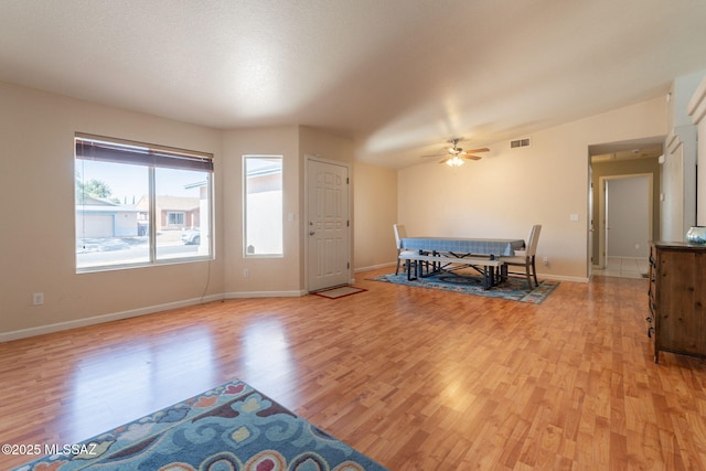 10236 E Rainbow Meadow Dr, Tucson, AZ 85747 - dining room with light wood-type flooring, healthy amount of natural light, and ceiling fan