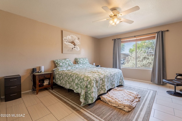10236 E Rainbow Meadow Dr, Tucson, AZ 85747 - bedroom featuring ceiling fan and baseboards