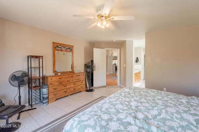 10236 E Rainbow Meadow Dr, Tucson, AZ 85747 - bedroom featuring light tile patterned floors and a ceiling fan