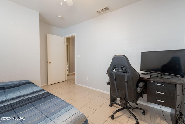 10236 E Rainbow Meadow Dr, Tucson, AZ 85747 - bedroom featuring light wood-style floors, ceiling fan, baseboards, and a desk