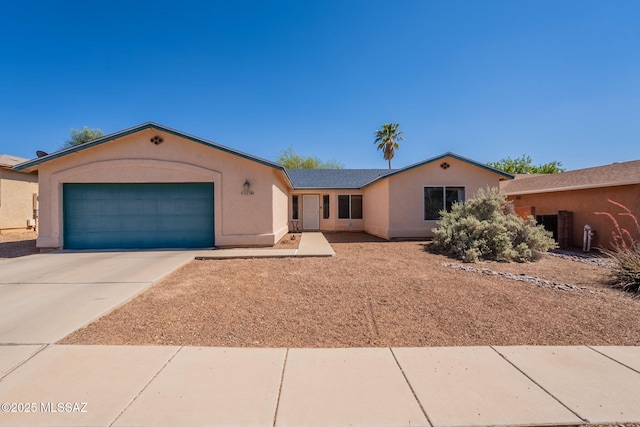 10236 E Rainbow Meadow Dr, Tucson, AZ 85747 - ranch-style home with an attached garage, stucco siding, and concrete driveway