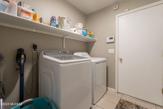 10236 E Rainbow Meadow Dr, Tucson, AZ 85747 - washroom with washer and dryer and light tile patterned floors