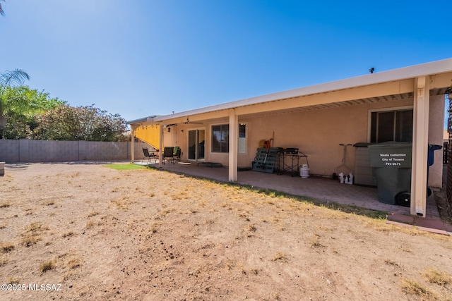10236 E Rainbow Meadow Dr, Tucson, AZ 85747 - rear view of house with a patio and stucco siding