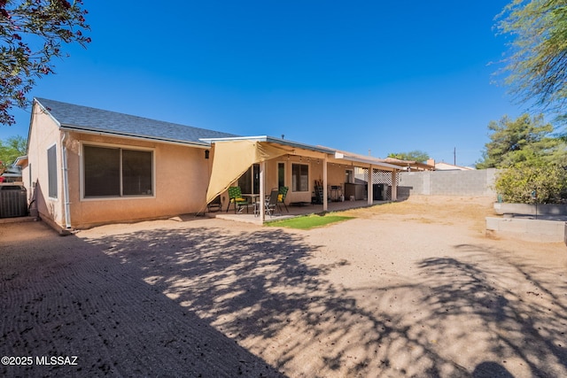 10236 E Rainbow Meadow Dr, Tucson, AZ 85747 - back of property featuring stucco siding, a patio, a fenced backyard, and central air condition unit