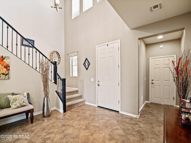 741 S Desert Haven Rd, Vail, AZ 85641 - entrance foyer featuring stairs, a high ceiling, and baseboards