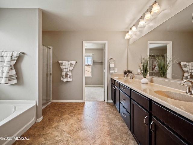 741 S Desert Haven Rd, Vail, AZ 85641 - full bath featuring double vanity, a garden tub, baseboards, and a shower