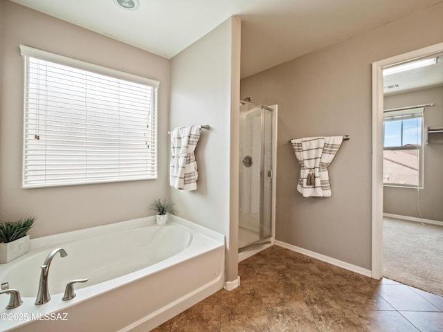 741 S Desert Haven Rd, Vail, AZ 85641 - bathroom featuring a bath, a stall shower, and baseboards