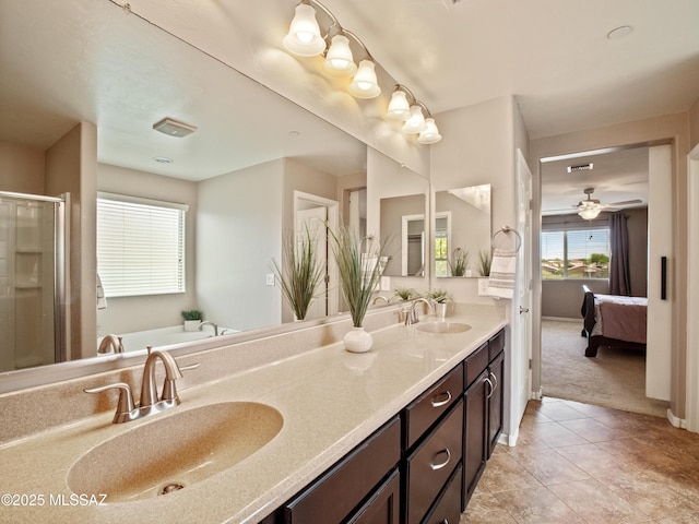 741 S Desert Haven Rd, Vail, AZ 85641 - full bath featuring ensuite bathroom, double vanity, a shower stall, a bath, and tile patterned floors
