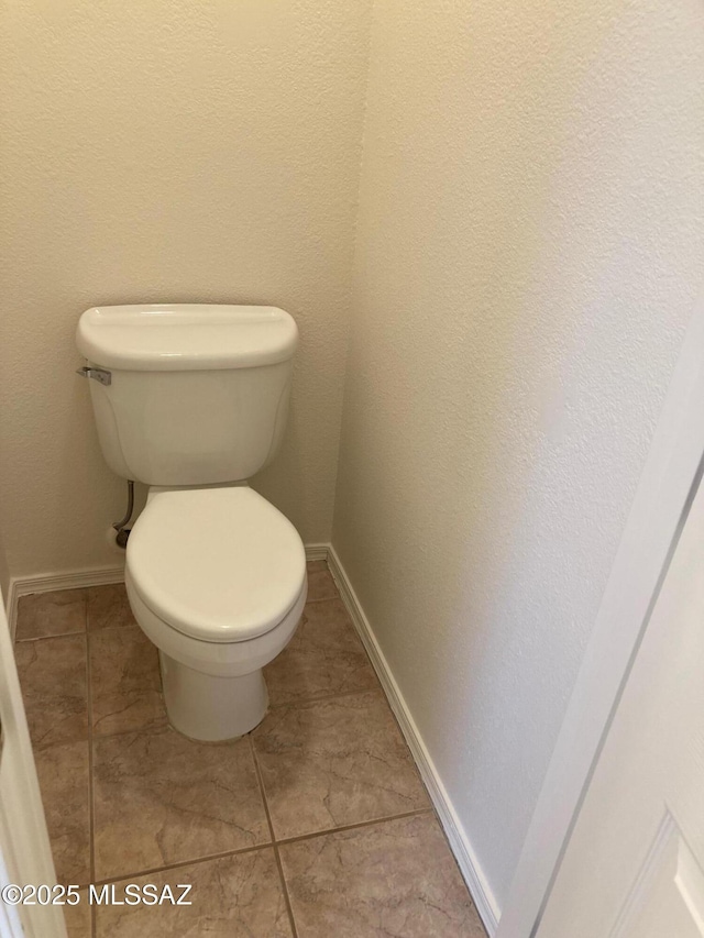 6936 W Sauceda Dr, Tucson, AZ 85743 - bathroom with toilet, baseboards, and tile patterned floors