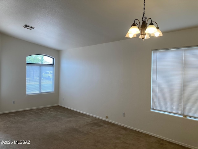 6936 W Sauceda Dr, Tucson, AZ 85743 - unfurnished room featuring dark carpet, a chandelier, and baseboards