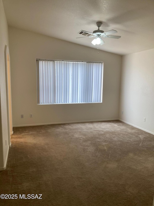 6936 W Sauceda Dr, Tucson, AZ 85743 - carpeted spare room with ceiling fan, baseboards, and arched walkways