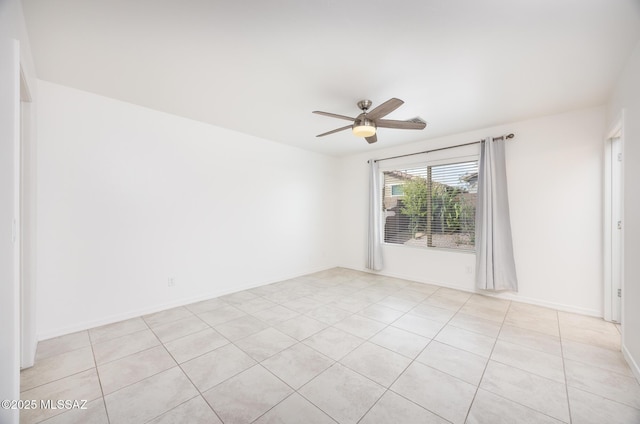 8608 N Genoa Ct, Tucson, AZ 85742 - empty room with a ceiling fan, light tile patterned floors, and baseboards