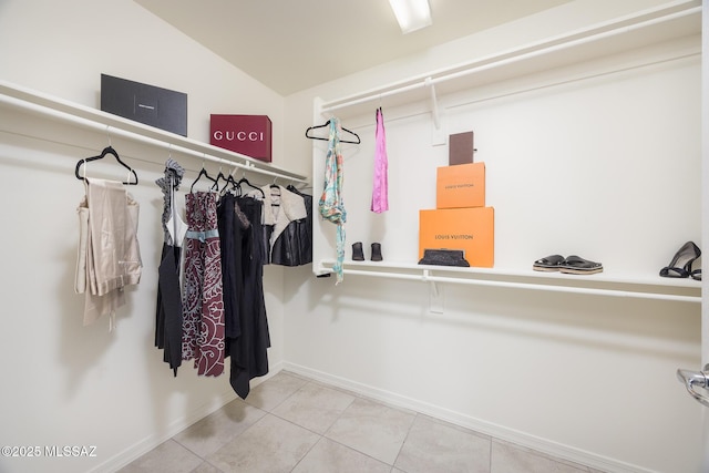 8608 N Genoa Ct, Tucson, AZ 85742 - walk in closet with tile patterned floors and lofted ceiling