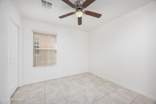 8608 N Genoa Ct, Tucson, AZ 85742 - spare room with a ceiling fan, baseboards, and light tile patterned floors