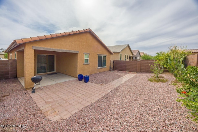 8608 N Genoa Ct, Tucson, AZ 85742 - back of property featuring stucco siding, a fenced backyard, and a patio area