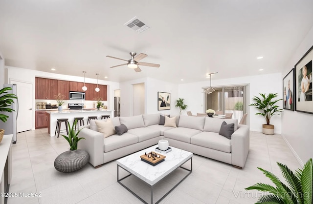 8608 N Genoa Ct, Tucson, AZ 85742 - living room featuring a ceiling fan, light tile patterned floors, and recessed lighting