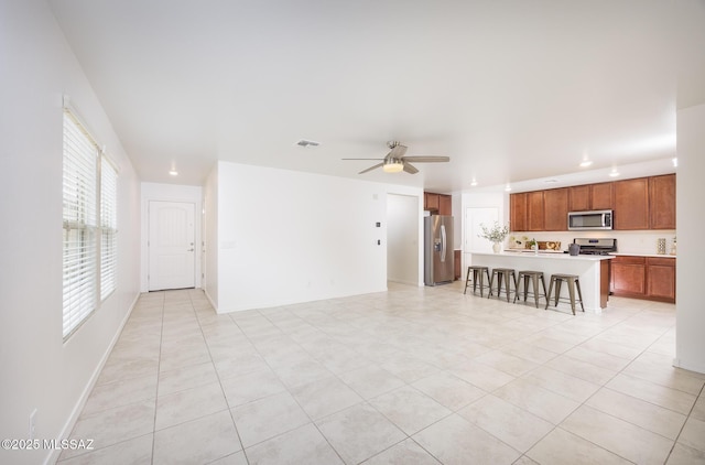 8608 N Genoa Ct, Tucson, AZ 85742 - living room with a ceiling fan, light tile patterned floors, recessed lighting, and baseboards