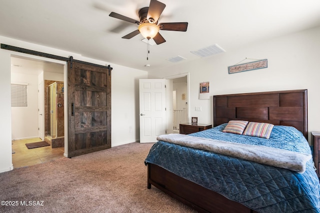 11370 E Creosote Range Dr, Tucson, AZ 85747 - carpeted bedroom featuring a barn door, baseboards, and a ceiling fan