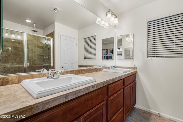 11370 E Creosote Range Dr, Tucson, AZ 85747 - full bathroom featuring double vanity, a stall shower, and baseboards