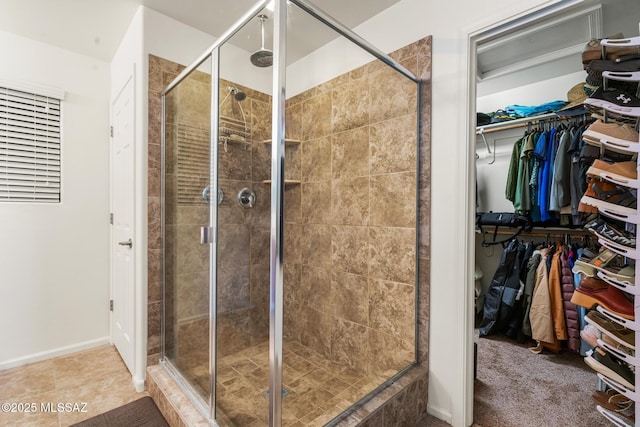 11370 E Creosote Range Dr, Tucson, AZ 85747 - bathroom featuring a stall shower and a walk in closet