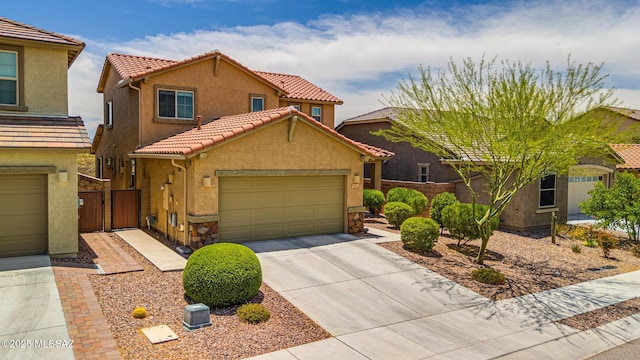 11370 E Creosote Range Dr, Tucson, AZ 85747 - view of front of home featuring stucco siding, concrete driveway, a tiled roof, stone siding, and a gate