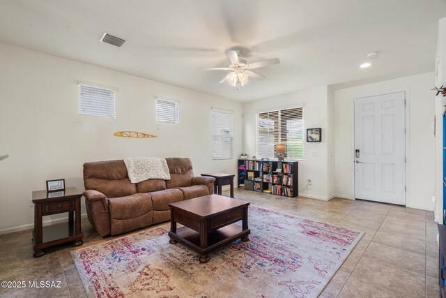 11370 E Creosote Range Dr, Tucson, AZ 85747 - living area with ceiling fan, light tile patterned flooring, and baseboards