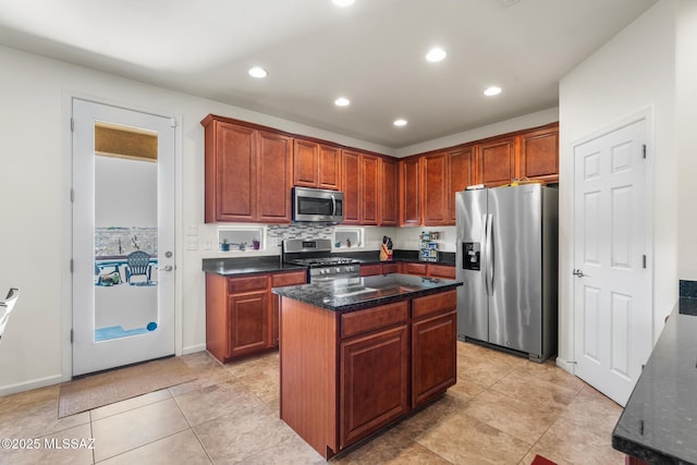 11370 E Creosote Range Dr, Tucson, AZ 85747 - kitchen featuring stainless steel appliances, recessed lighting, a center island, dark stone counters, and light tile patterned floors