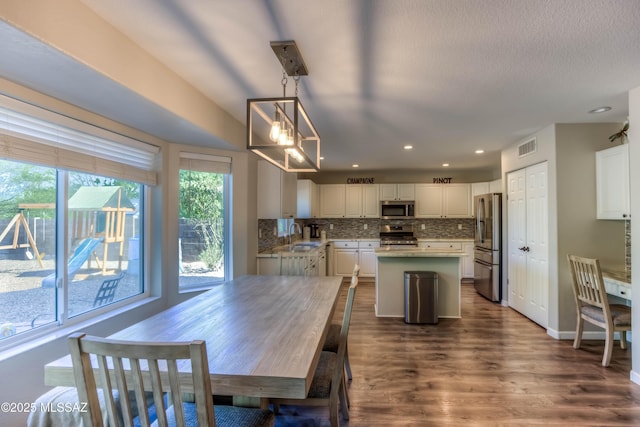 952 S Rincon Rising Rd, Tucson, AZ 85748 - dining space featuring dark wood-type flooring and recessed lighting