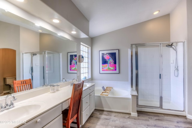 952 S Rincon Rising Rd, Tucson, AZ 85748 - full bathroom with a stall shower, vanity, a garden tub, wood finished floors, and recessed lighting