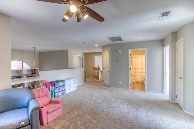 952 S Rincon Rising Rd, Tucson, AZ 85748 - living area with carpet, a ceiling fan, an upstairs landing, and baseboards