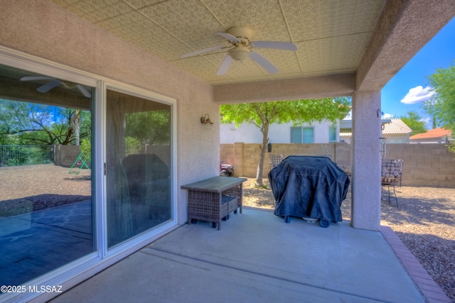 952 S Rincon Rising Rd, Tucson, AZ 85748 - fenced backyard featuring a ceiling fan, a patio area, and grilling area