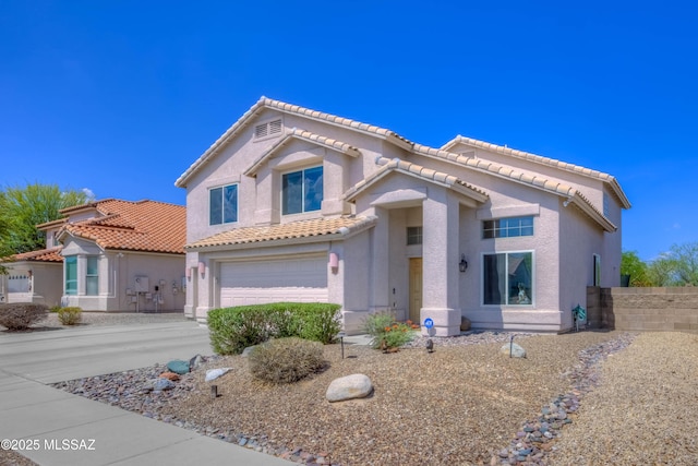 952 S Rincon Rising Rd, Tucson, AZ 85748 - mediterranean / spanish-style home with a garage, stucco siding, a tile roof, and driveway