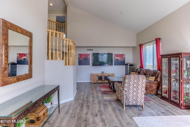 952 S Rincon Rising Rd, Tucson, AZ 85748 - living room featuring high vaulted ceiling, wood finished floors, and baseboards