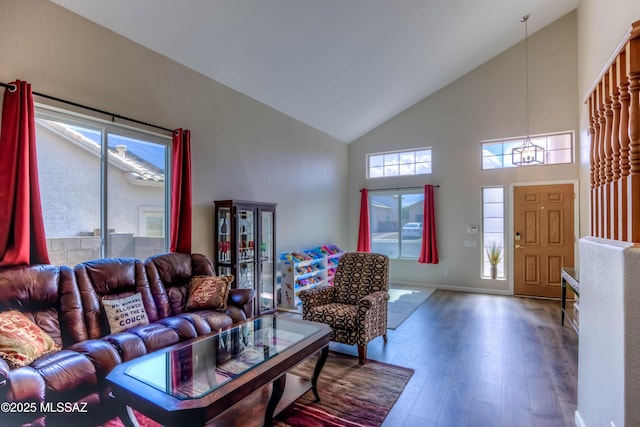 952 S Rincon Rising Rd, Tucson, AZ 85748 - living area with high vaulted ceiling, hardwood / wood-style flooring, a chandelier, and baseboards