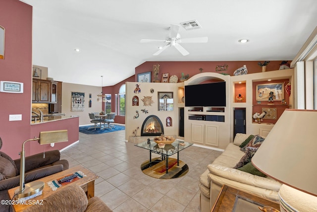 65535 E Rose Ridge Dr, Saddlebrooke, AZ 85739 - living area featuring light tile patterned floors, a ceiling fan, vaulted ceiling, and recessed lighting